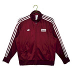 Abrigo Oasis x Adidas 2025