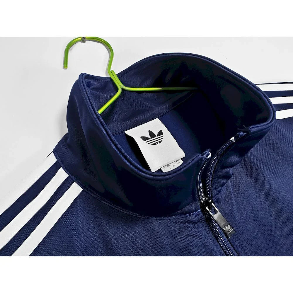 Abrigo Oasis x Adidas 2025