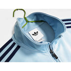 Abrigo Oasis x Adidas 2025